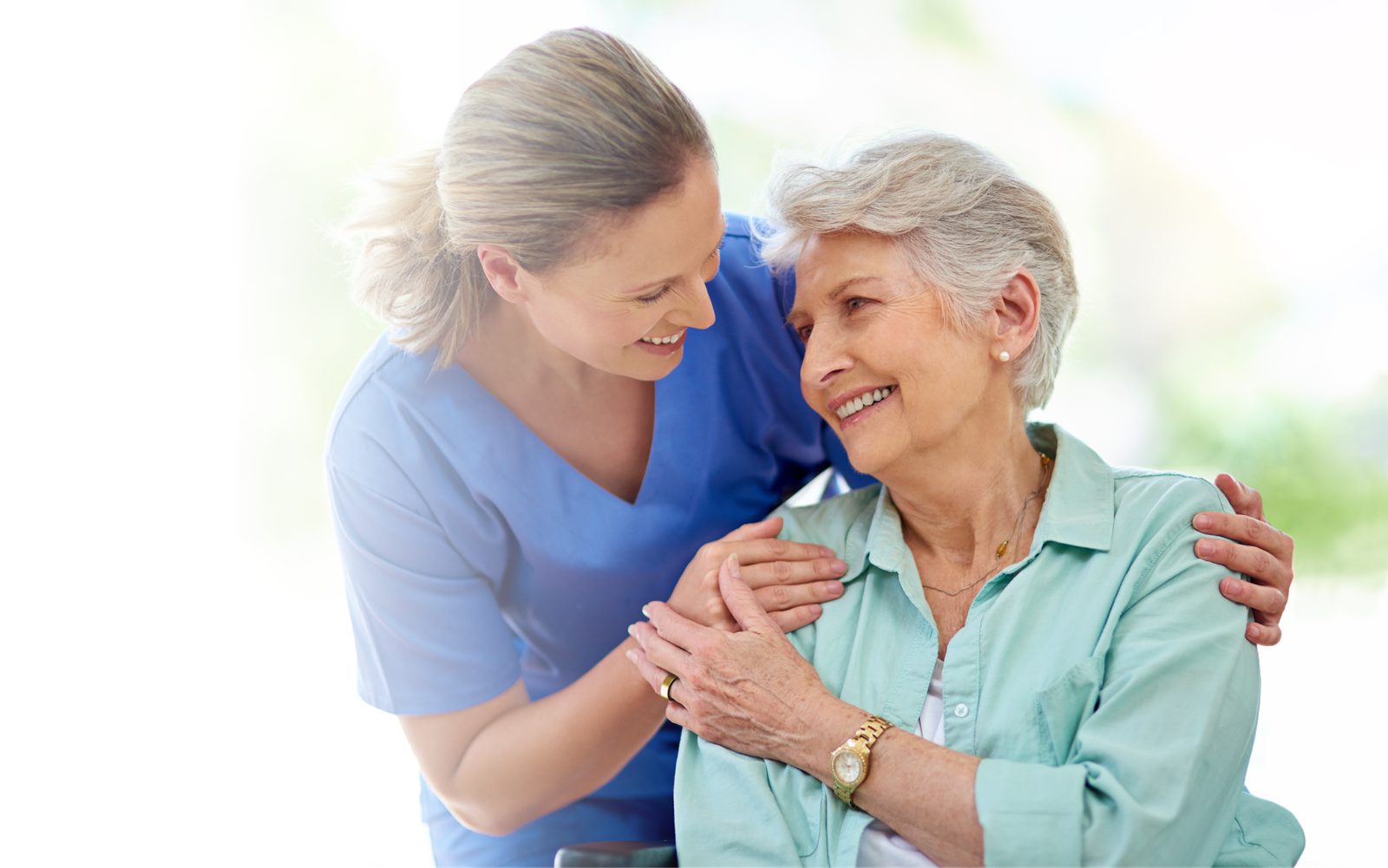 A caregiver and a client embracing