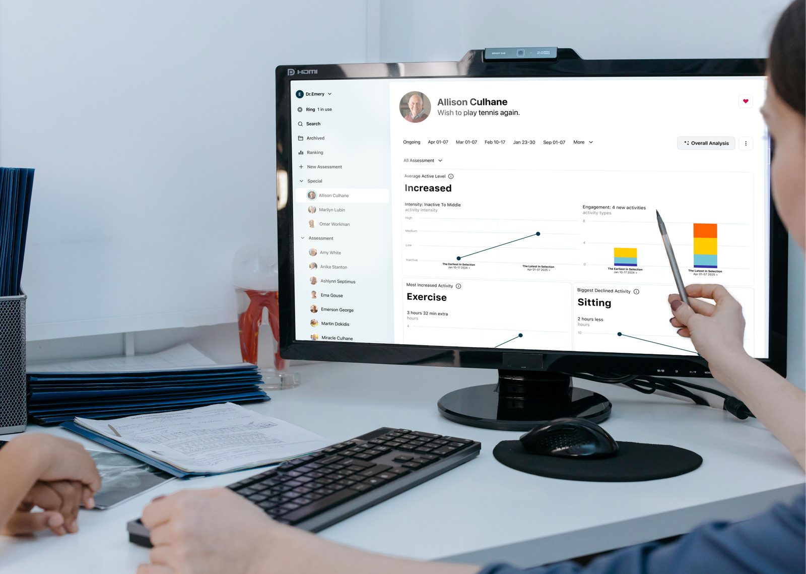 A care coordinator working at a desktop