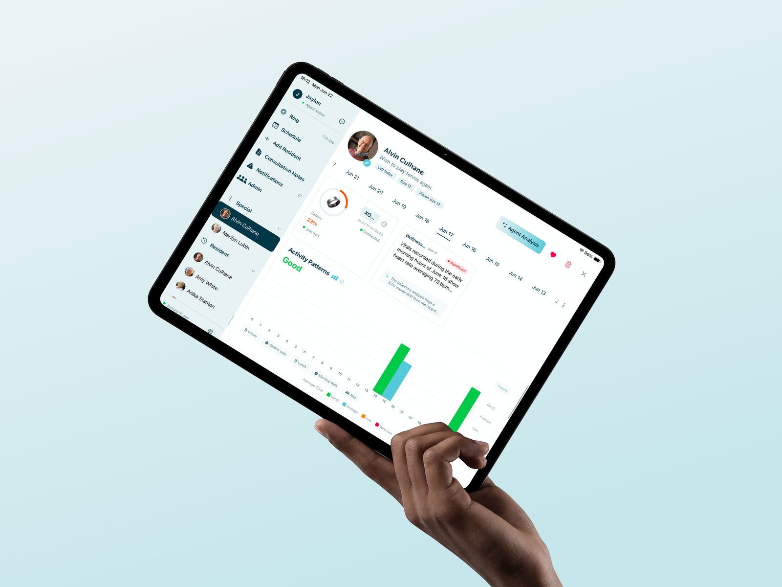 An operator-branded application on a tablet, held in a hand